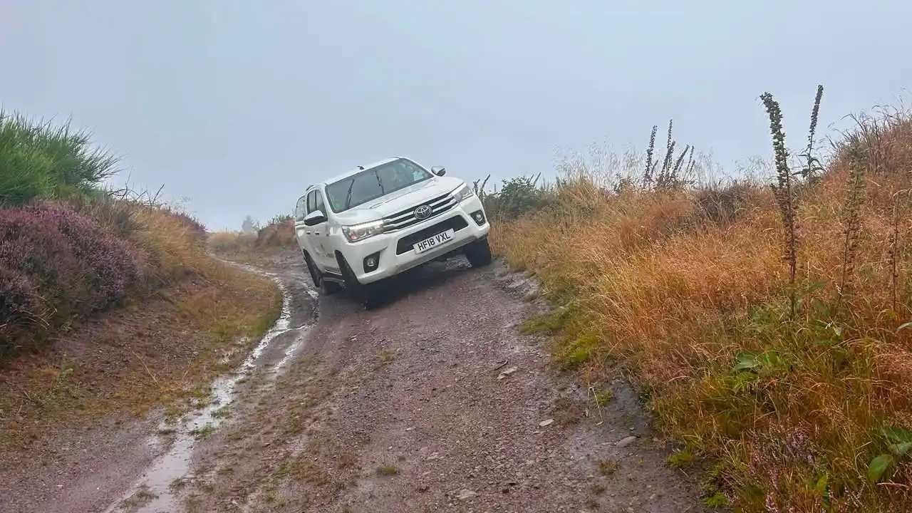 Lantra 4x4 operator training for NATS tackling an off-camber muddy track near Glenrothes, Fife