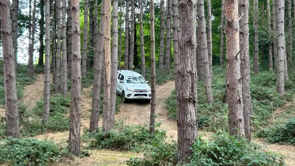 BT Lantra 4x4 operator training on a narrow woodland track near Maidstone, Kent